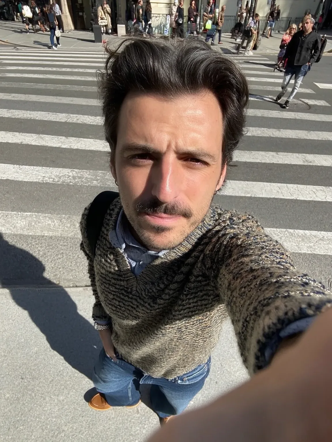Confident man looking in mirror